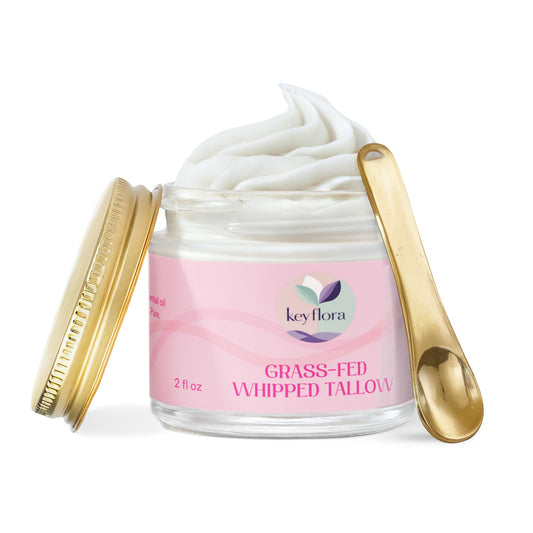 Keyflora Grass-Fed Whipped Tallow balm open jar with gold spoon